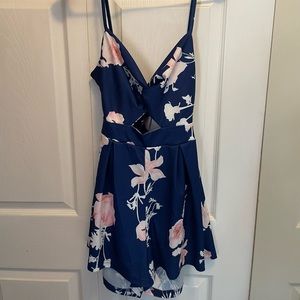 Floral print romper with adjustable straps. New, never worn.